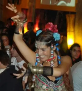 Ana in a tribal-style costume with flowers and beaded ornaments in her hair